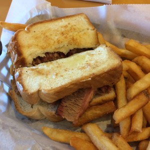 BBQ brisket sandwich with fries